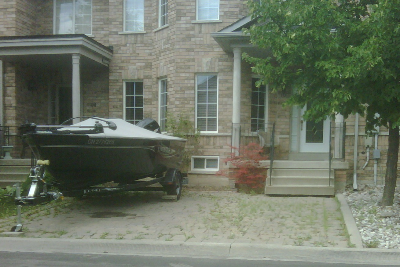 Picture of a boat parked incorrectly on a yard