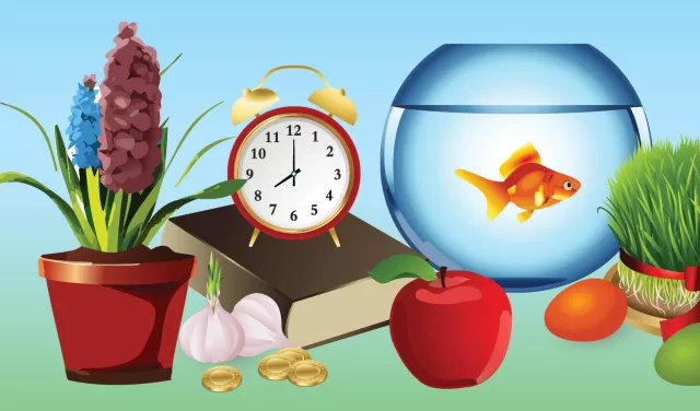 An assortment of items including a clock and fish bowl, and fruit