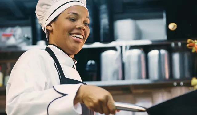 A chef cooking in a kitchen