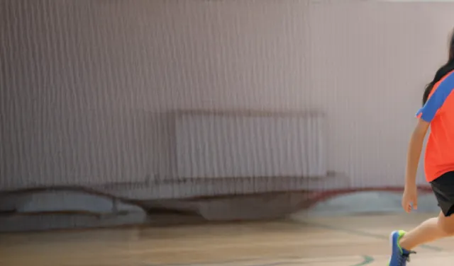 Kids playing indoor basketball
