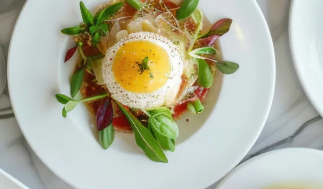 Overview of different colourful food on white plates