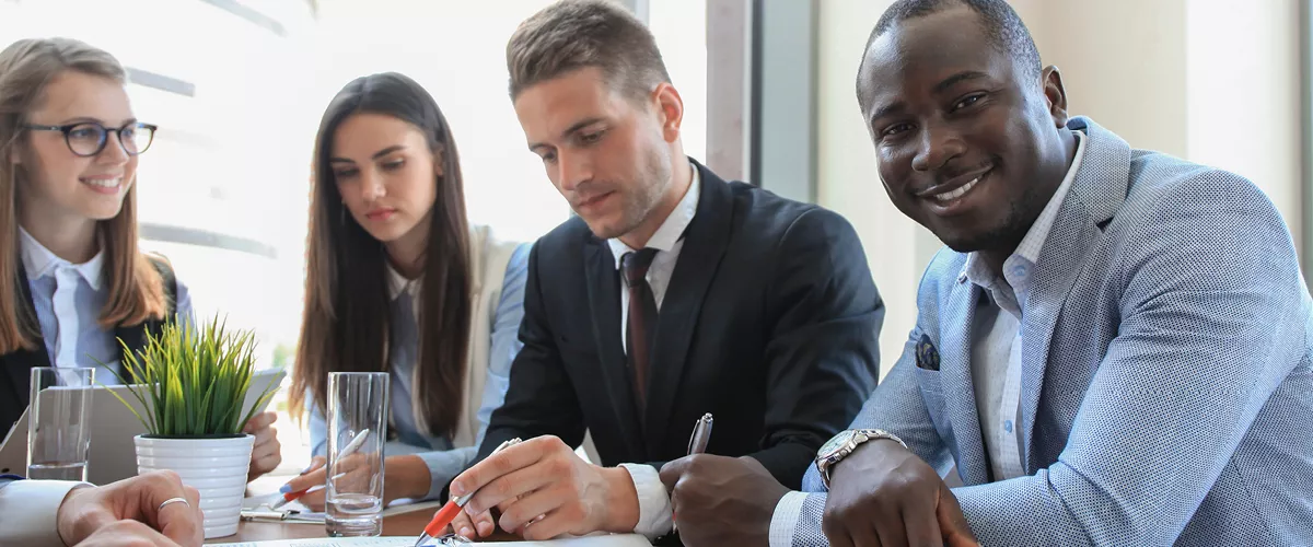 Four people sitting at a table.