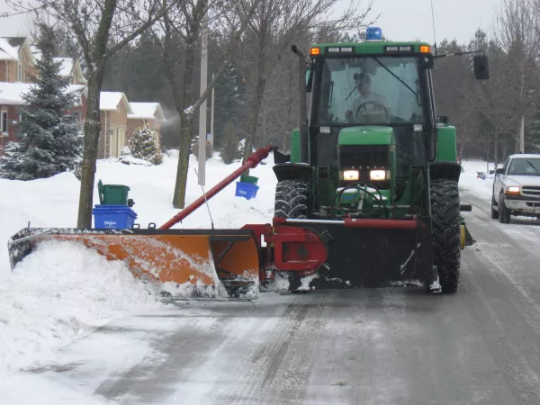 A windrow clearing vehicle.