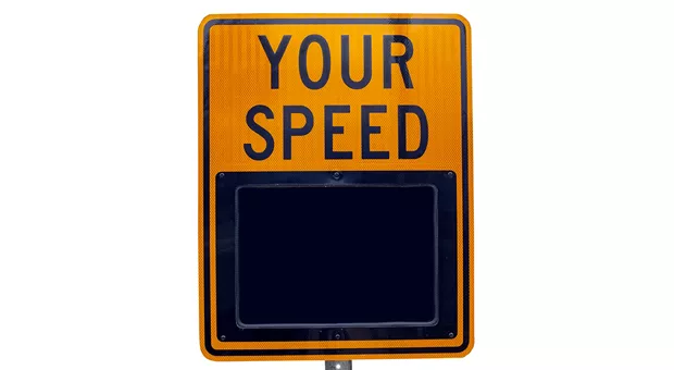 A road sign with the text "Your Speed" written on it that displays your current driving speed.