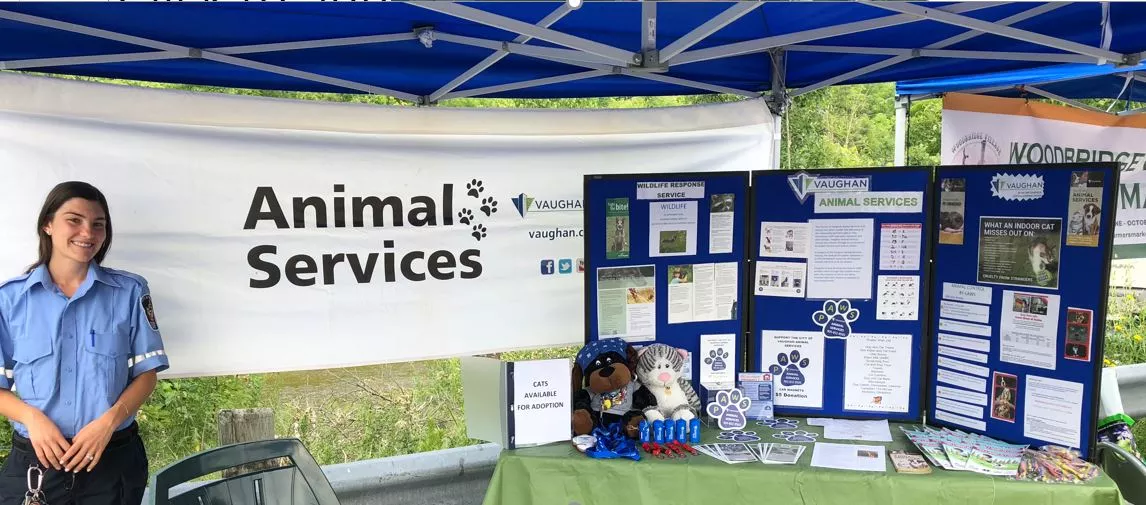 Animal Services staff standing in education booth