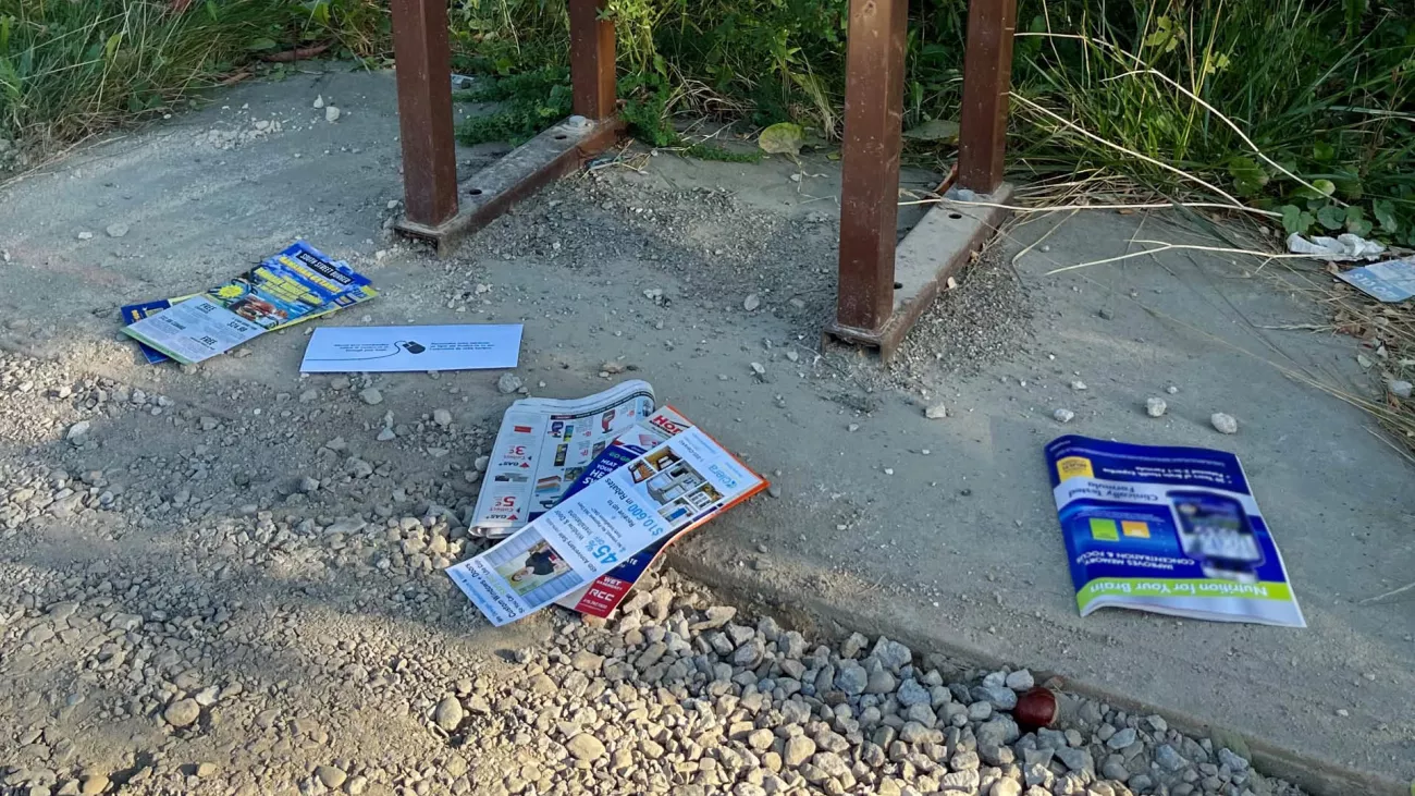 Littered mail on the ground