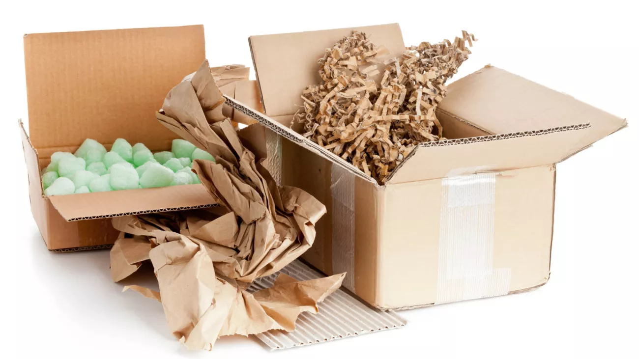 cardboard boxes, packing peanuts and shredded paper