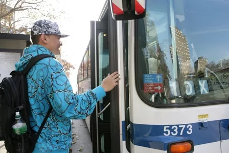 A person entering a bus.