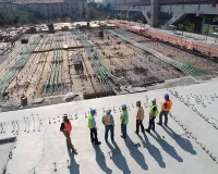 people observing a construction site