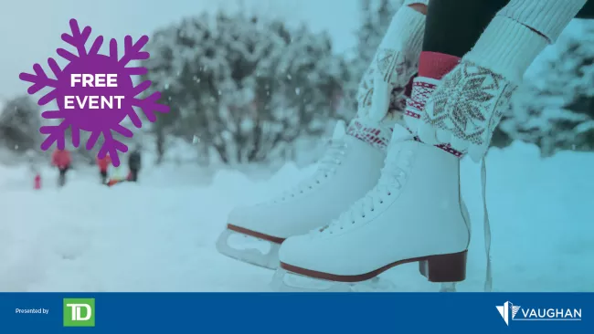 A woman lacing up her skates. 