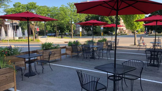 An outdoor seasonal patio in the summer