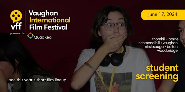 Teenage girl watching a movie looking shocked.