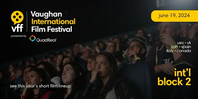 Group of people at a movie theater watching a movie.