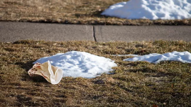 Trash belongs in the garbage, not on your lawn!
