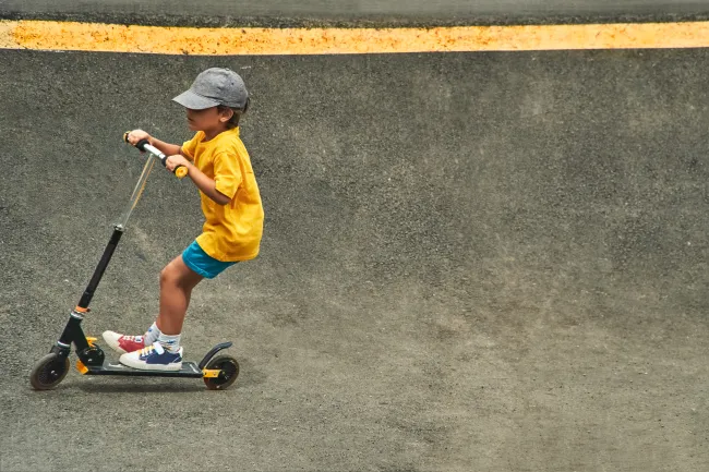A kid on a scooter