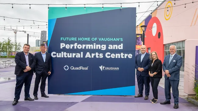 Mayor and Council in front of sign