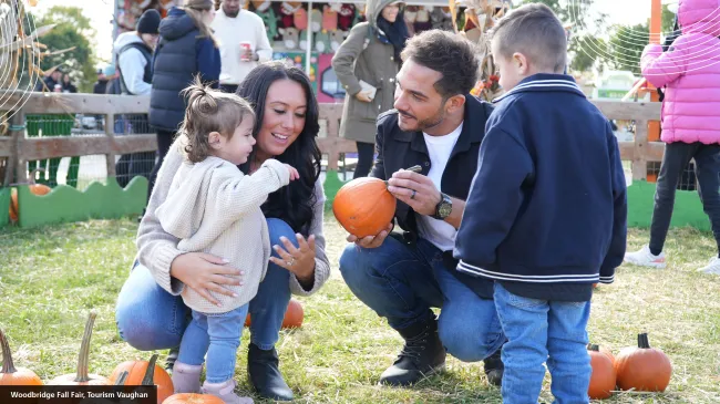 a family at a pumpkin patch