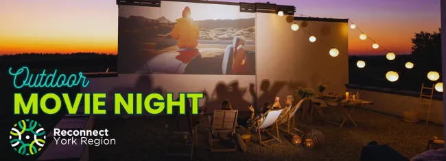 Banner image promoting Outdoor Movie Night by Reconnect York Region, showing people watching a projected film outdoors at sunset with string lights overhead