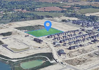 An aerial view of the Purpleville Park site with a location marker on top of it.