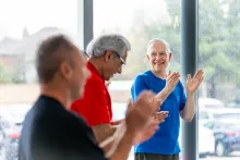 3 guys clapping
