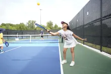 A girl playing pickleball at Carrville Community Centre outdoor court