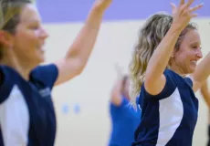 Fitness instructors leading a class.