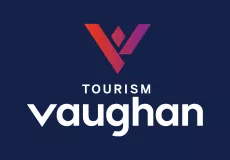 The Tourism Vaughan logo on a dark blue background with a red-purple V.