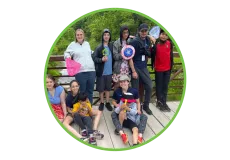 A group of inclusion campers and their camp counsellor.