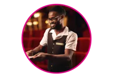 An usher receiving tickets at a theatre