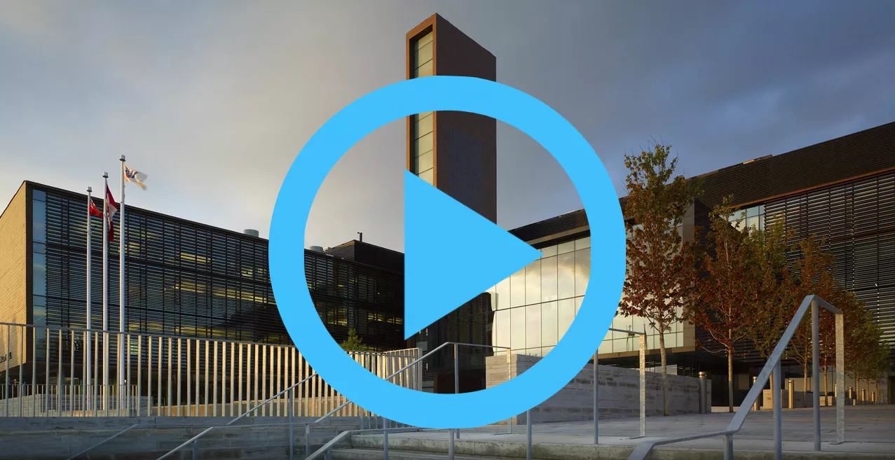A view of Vaughan City Hall with a playbutton over-layed on top.