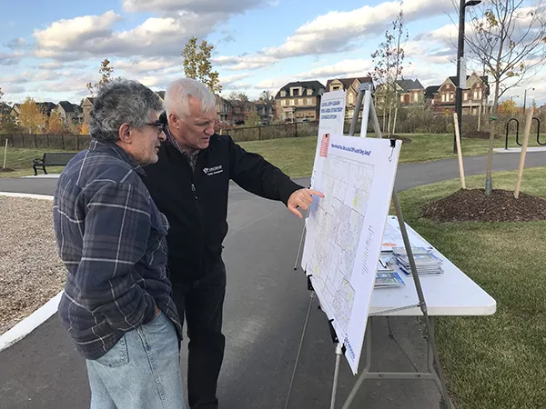 Image is of the local off-leash dog area community engagement.