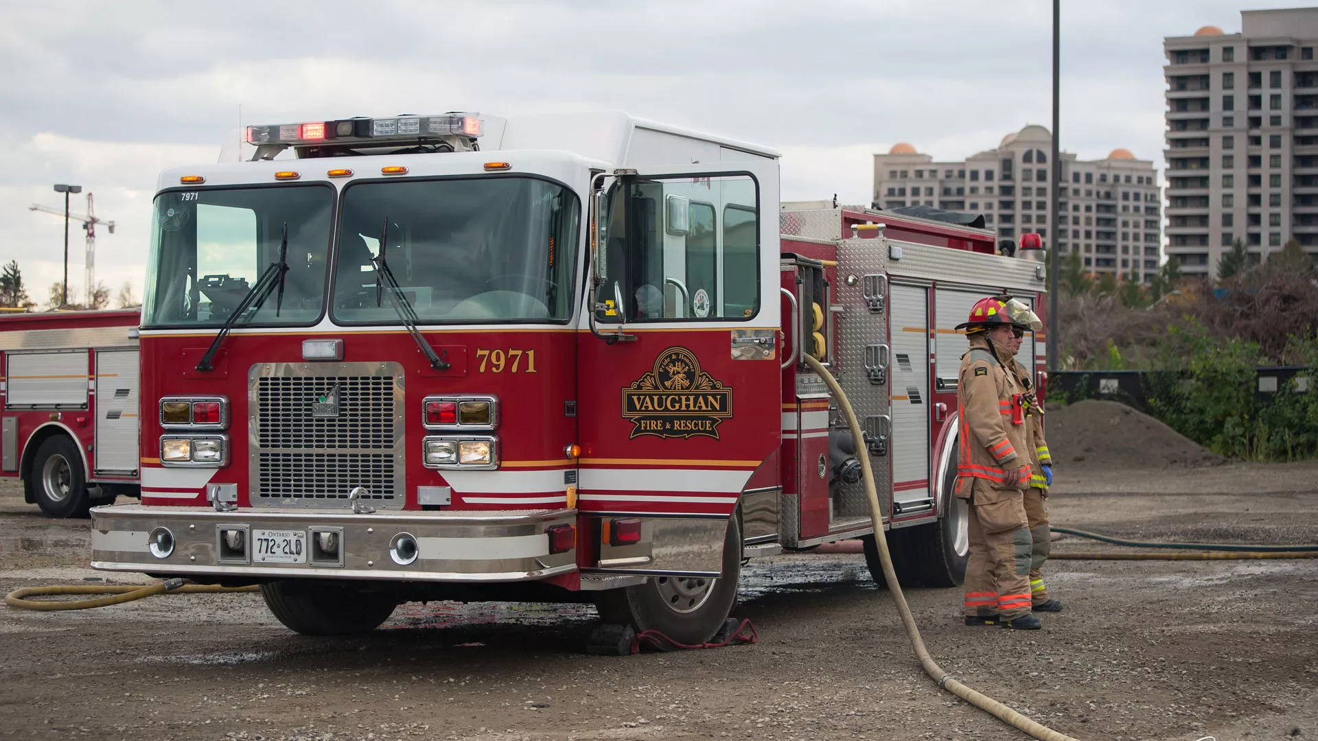 Fire fighter standing in front of a fire truck