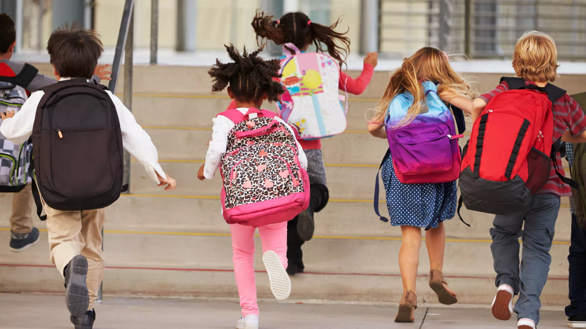 Kids running with backpacks