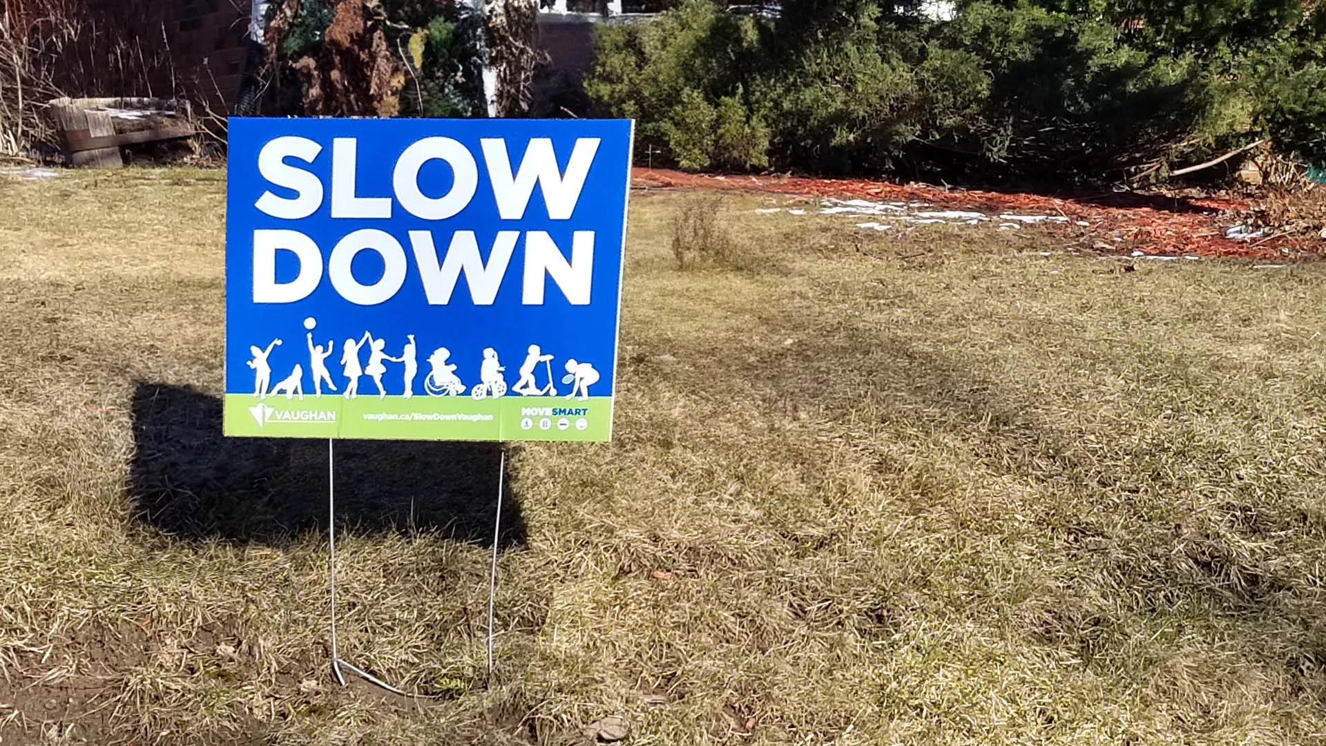 Slow Down Vaughan sign on a lawn. 