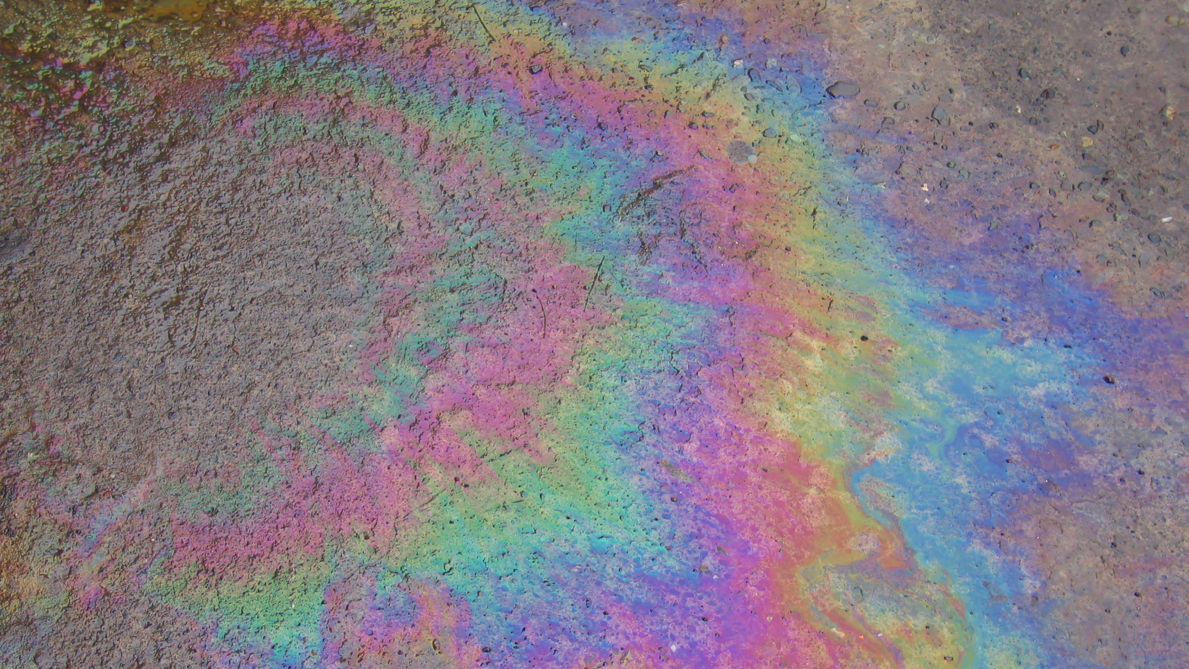 a coloured substance spilled on pavement
