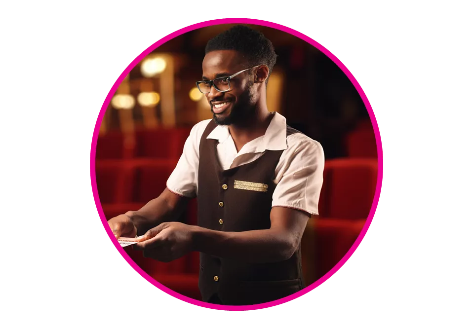 An usher receiving tickets at a theatre