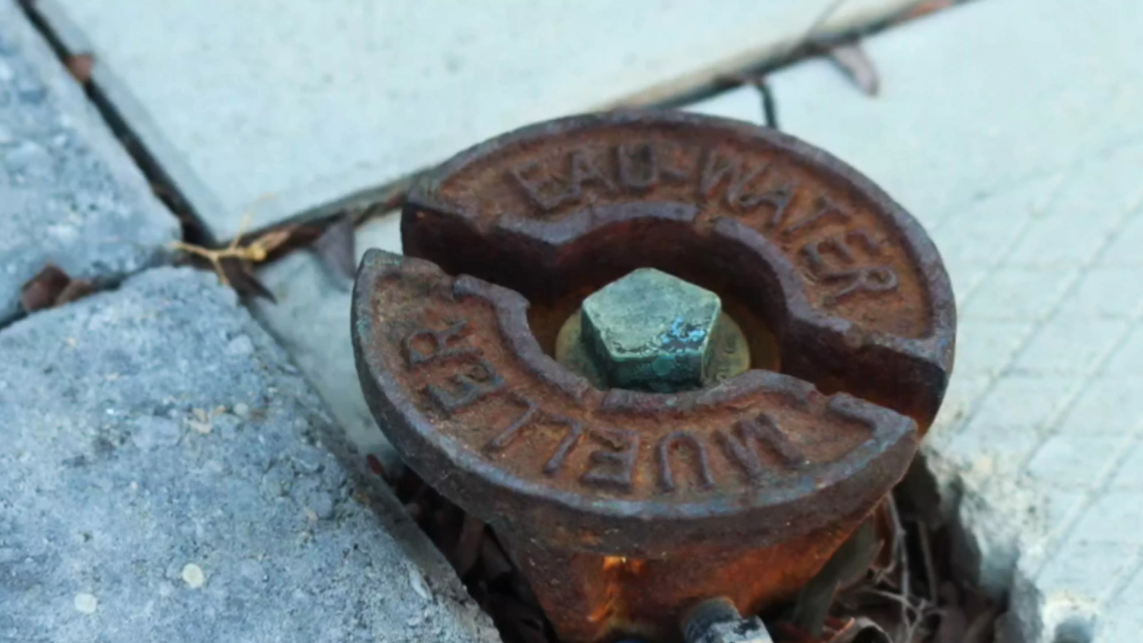 a curb box in a driveway