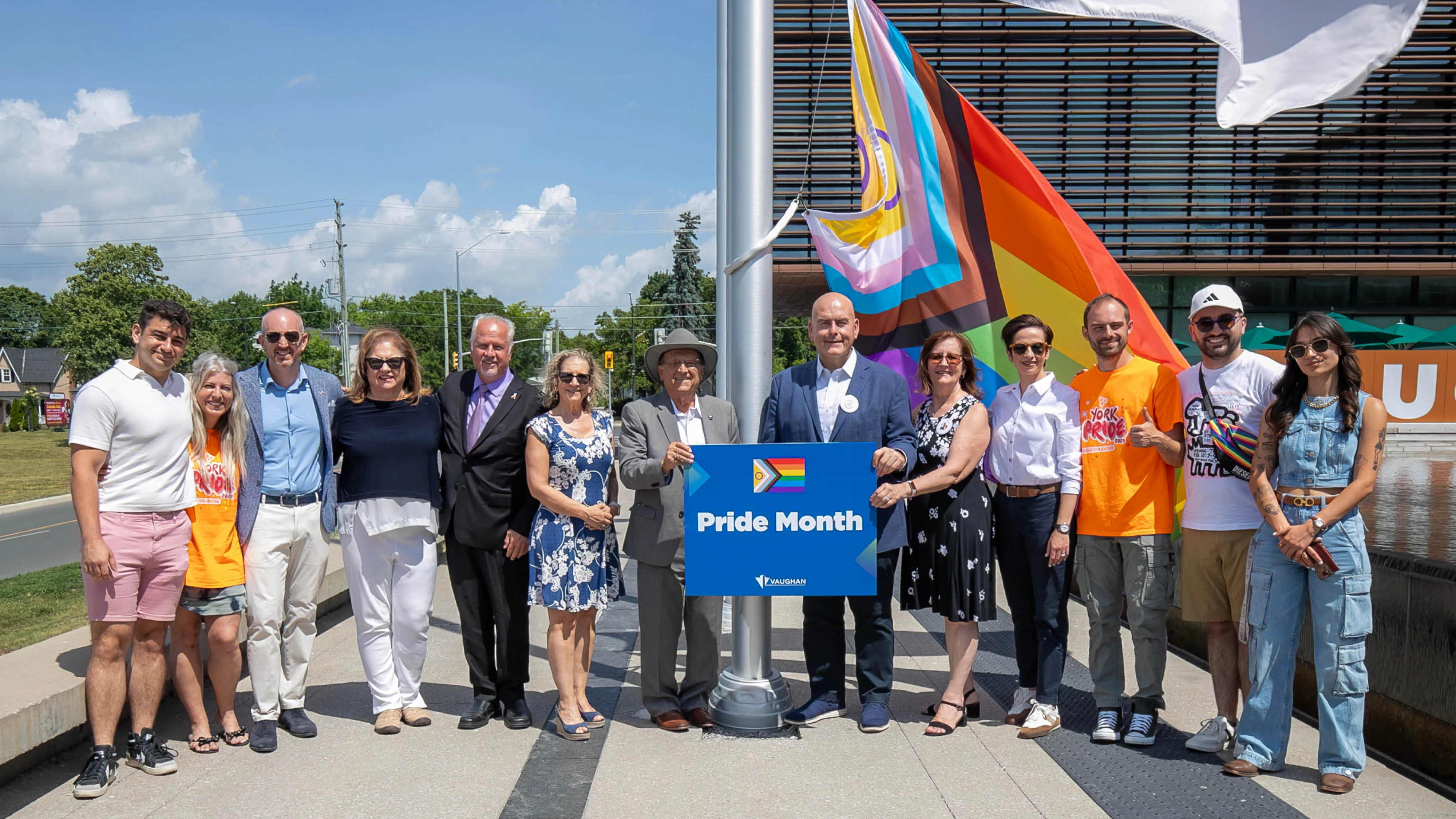 Mayor Steven Del Duca, Members of Council, Member of Parliament for Thornhill Melissa Lantsman, representatives from York Pride, Pflag York Region and spoken-word artist Madeline Rose Fiore in front of Vaughan City Hall at Pride flag raising on June 24, 2025