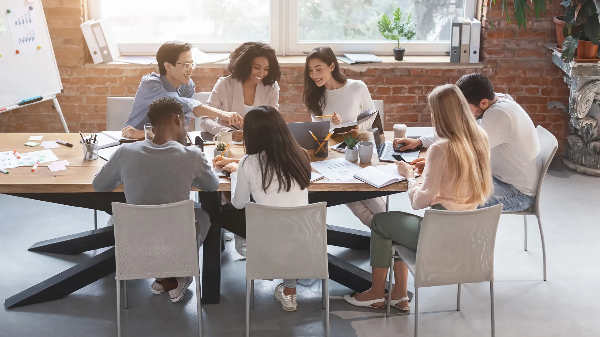People working around a large table