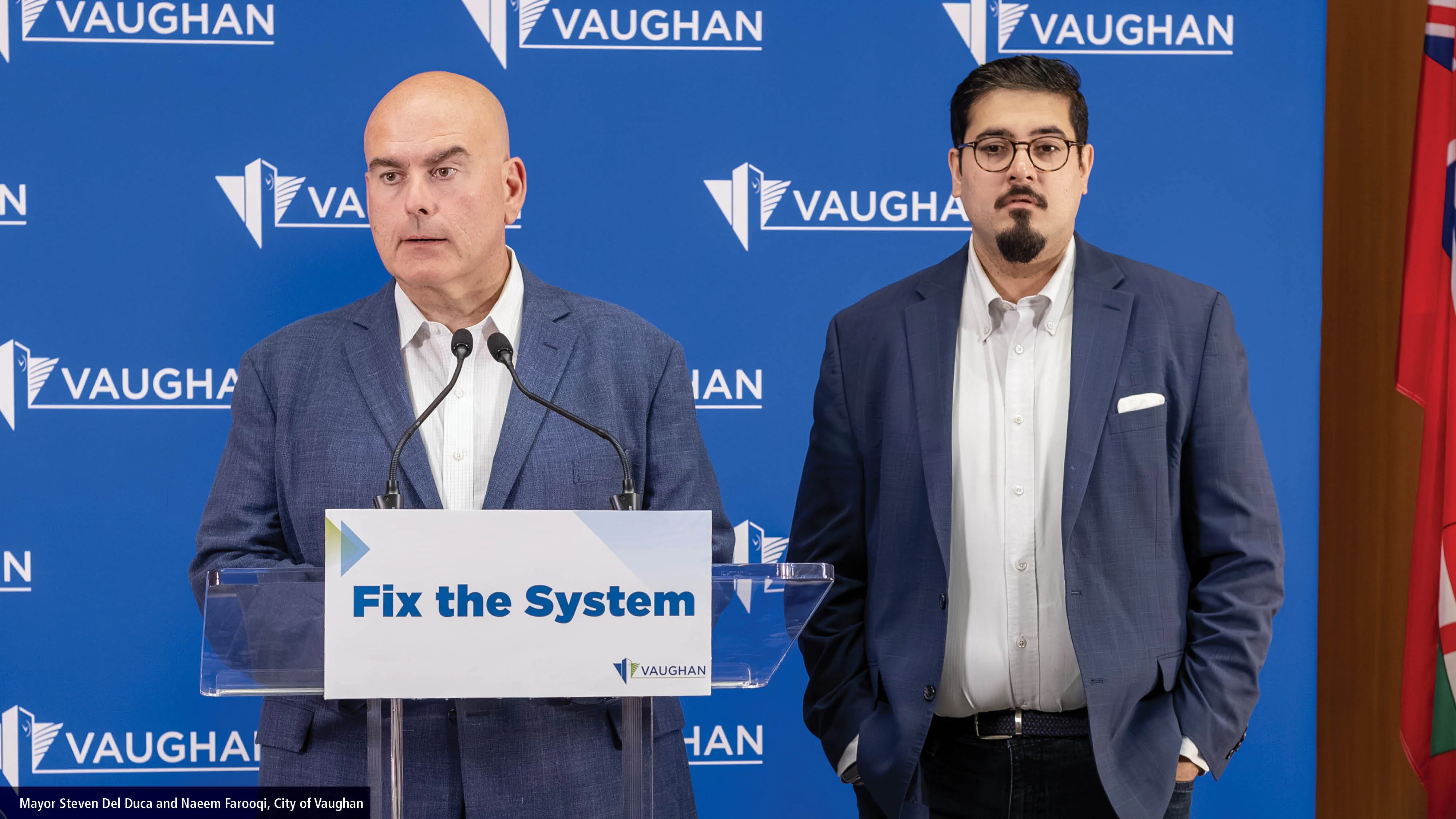 mayor steven del duca and naeem farooqi at a podium in vaughan city hall
