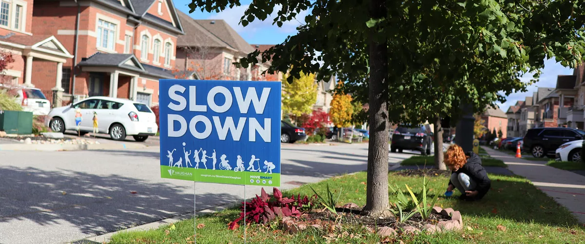 A #SlowDownVaughan sign on a resident's lawn.